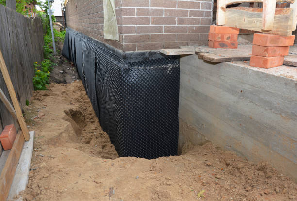 Happy homeowners after waterproofing job in Marilla